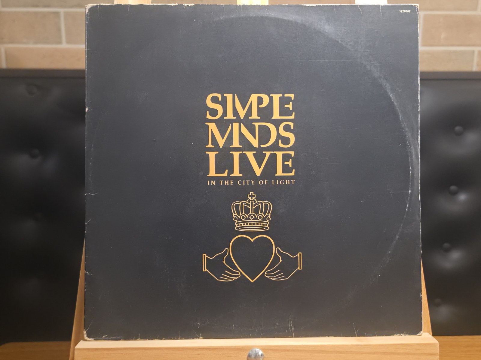 Capa de Simple Minds — Live in the City of Light